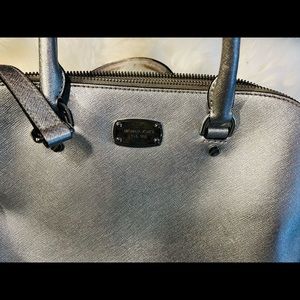 Silver Michael Kors bag with strap